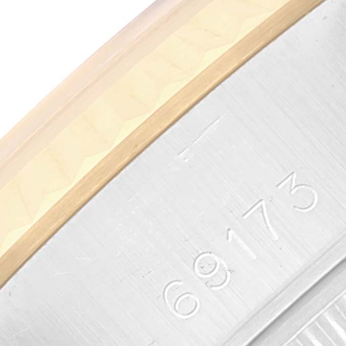 This close-up angle shows the model number engraving on the side of the Rolex Datejust 69173 Women's Steel and Gold (two tone) White Dial 69173 Women's Steel and Gold (two tone) White Dial watch.