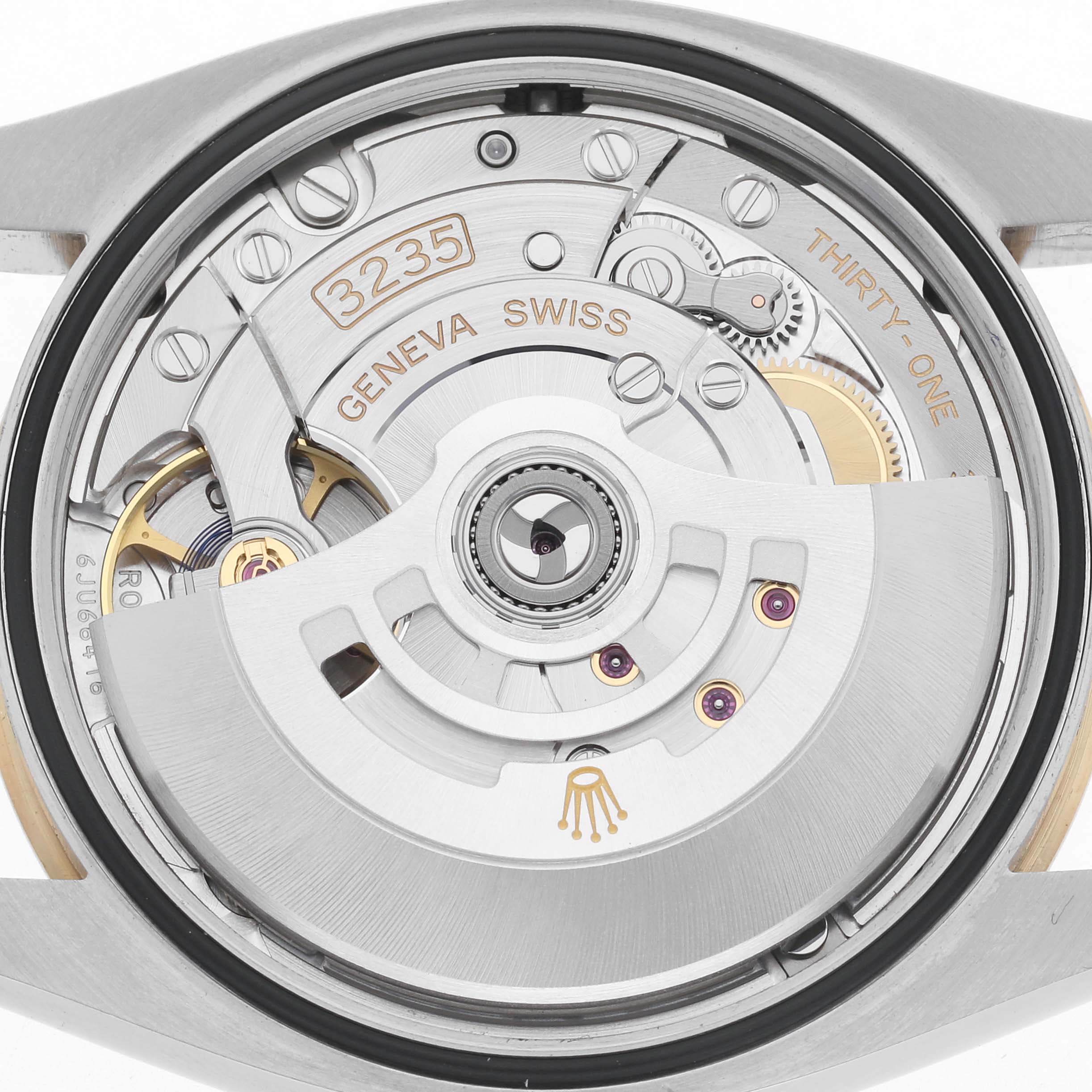 The image shows the Rolex Datejust 126203 Men
s Steel and Gold (two tone) Grey Dial 126203 Men
s Steel and Gold (two tone) Grey Dial
s internal movement from the back, highlighting the rotor and intricate mechanics.