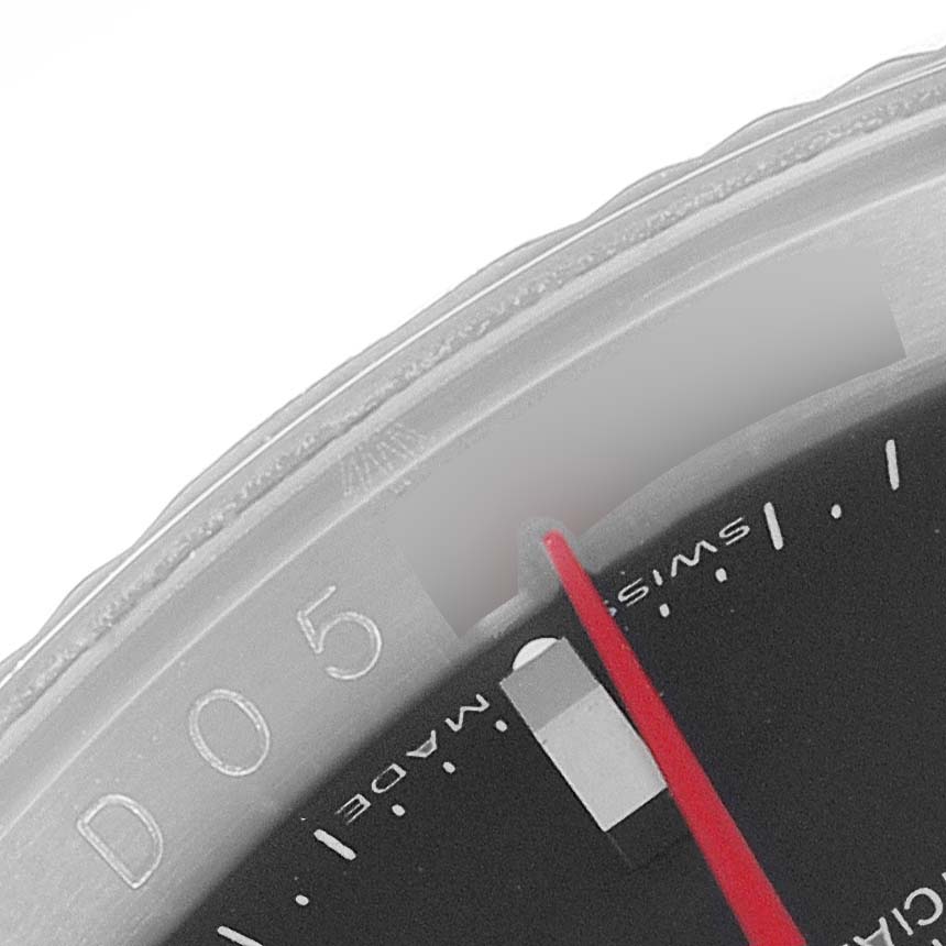 This image shows the upper-left section of the bezel and dial of a Rolex Turn-o-Graph 116264 Men
s Stainless Steel Black Dial 116264 Men
s Stainless Steel Black Dial watch.