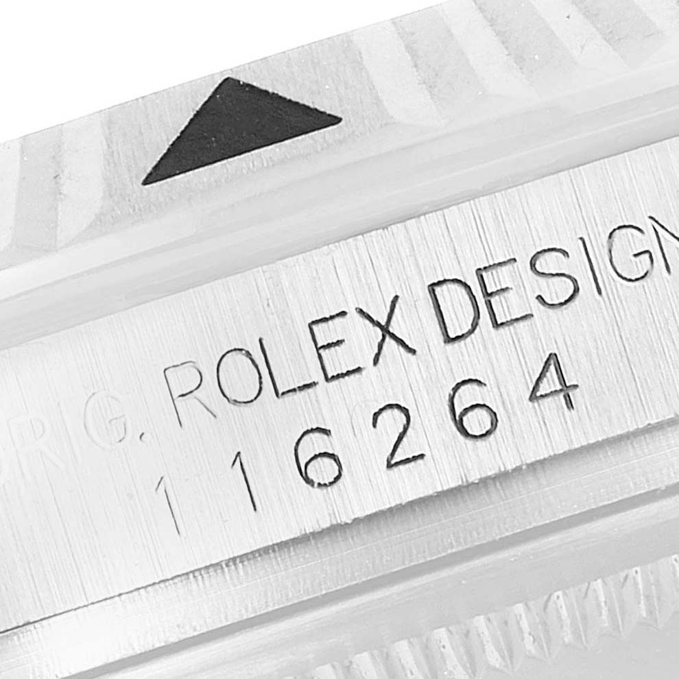 The image shows a close-up of the bezel and serial number engraving on a Rolex Turn-o-Graph 116264 Men
s Stainless Steel Black Dial 116264 Men
s Stainless Steel Black Dial model.