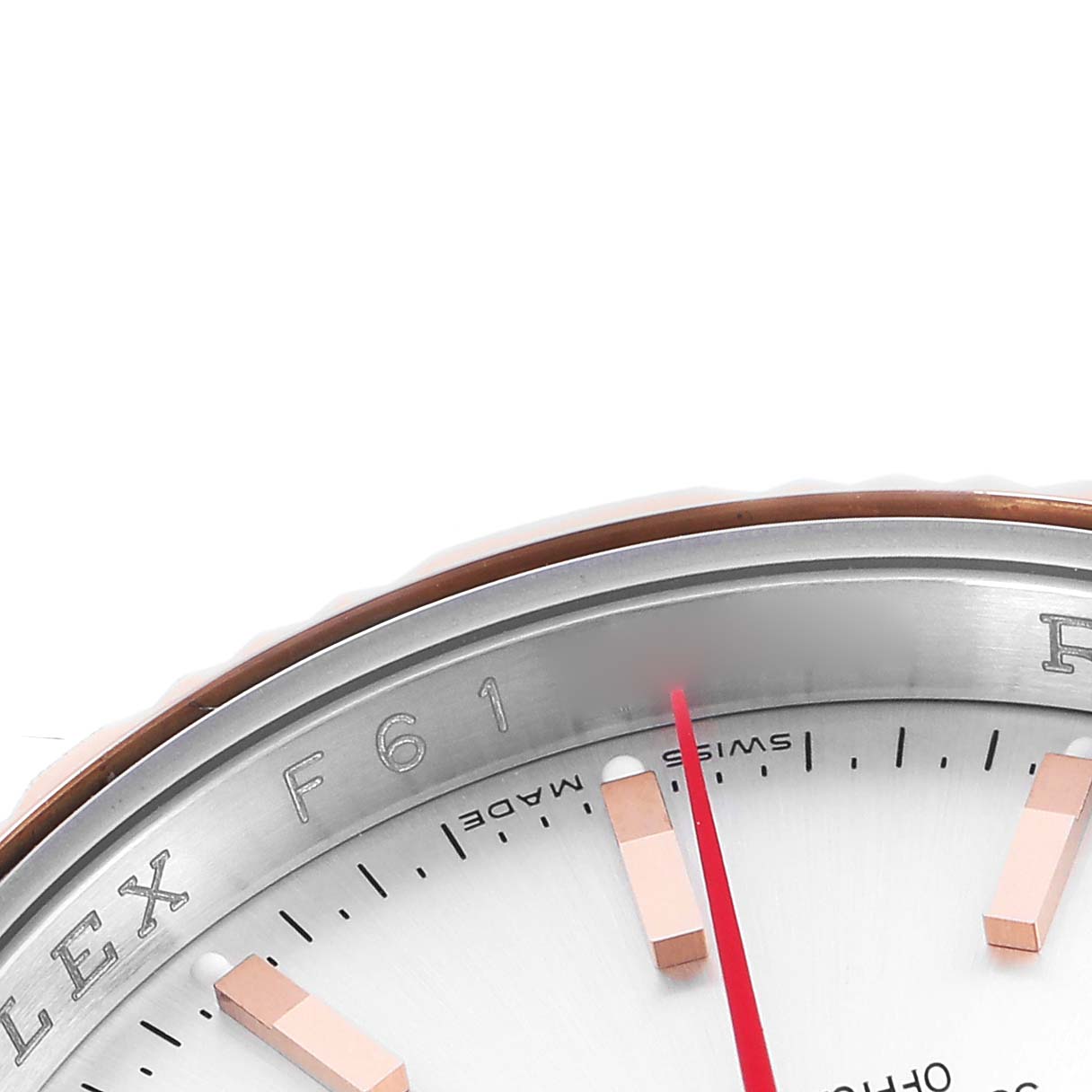 The image shows a close-up of the dial and bezel of a Rolex Turn-o-Graph 116261 Men's Steel and Gold (two tone) Silver Dial, highlighting the indices and part of the minute hand.