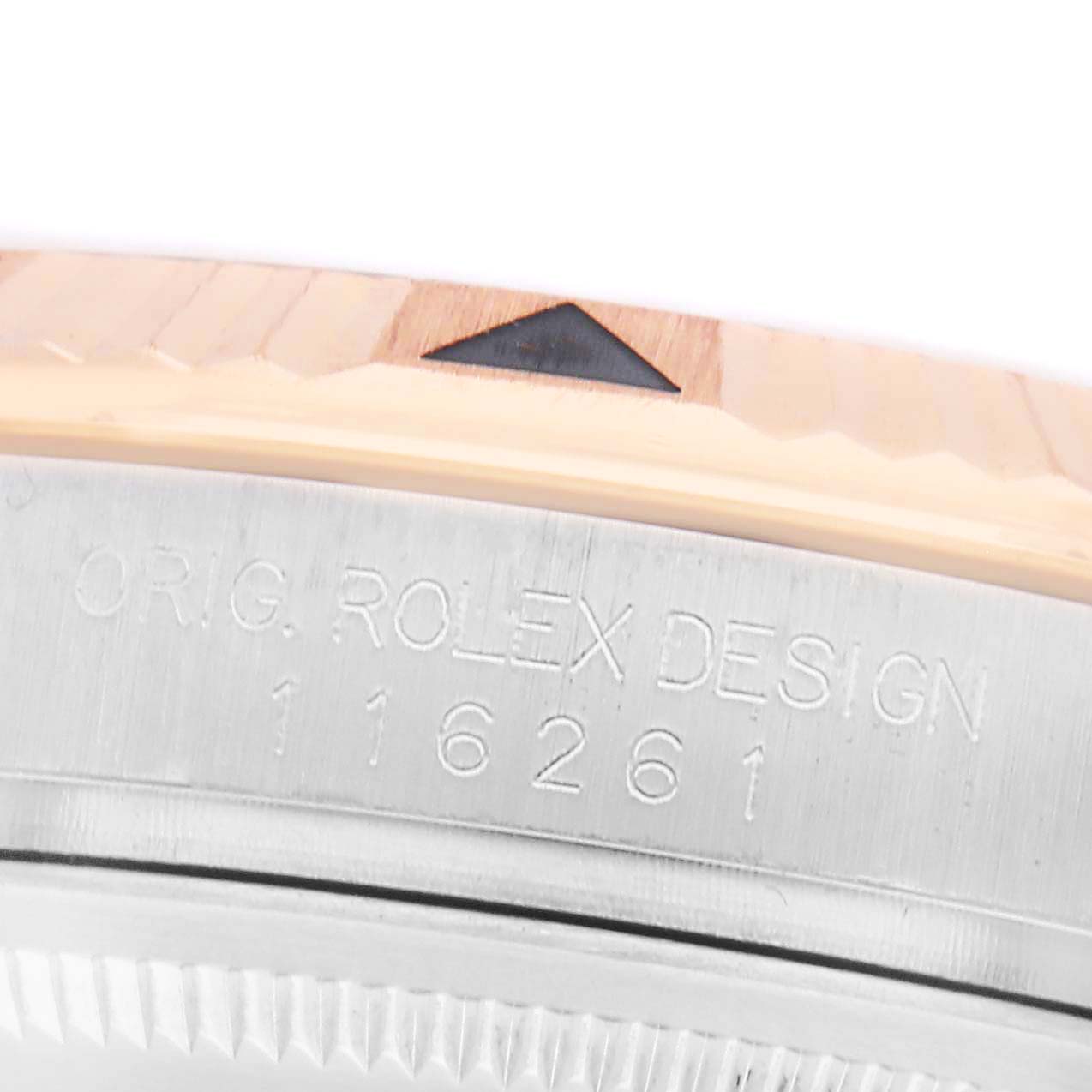 The image shows a close-up of the Rolex Turn-o-Graph 116261 Men's Steel and Gold (two tone) Silver Dial watch bezel and case side with engraved model info.