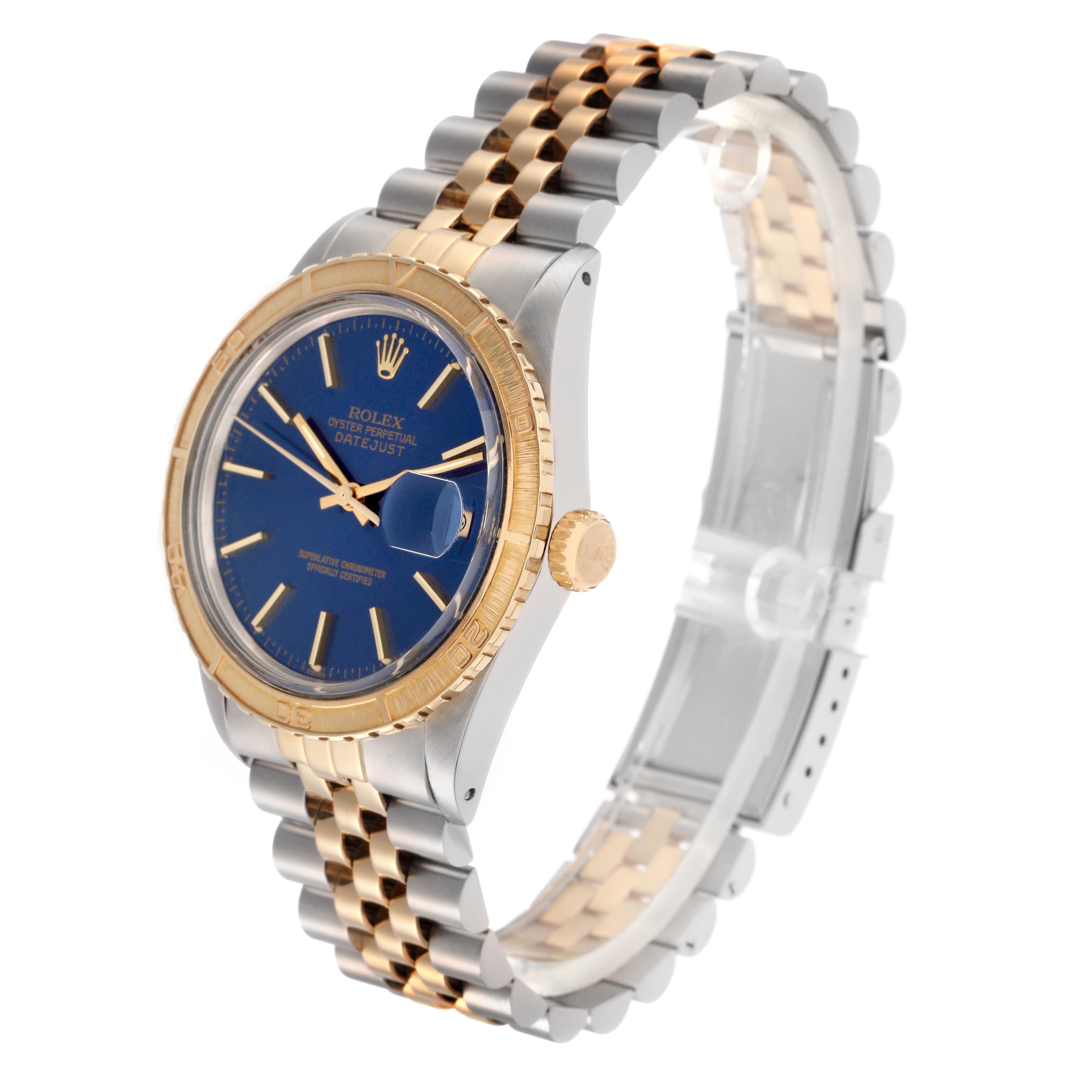 The Rolex Turn-o-Graph 16253 Men
s Steel and Gold (two tone) Blue Dial 16253 Men
s Steel and Gold (two tone) Blue Dial watch is shown at an angle highlighting the face, bezel, crown, and two-tone bracelet.