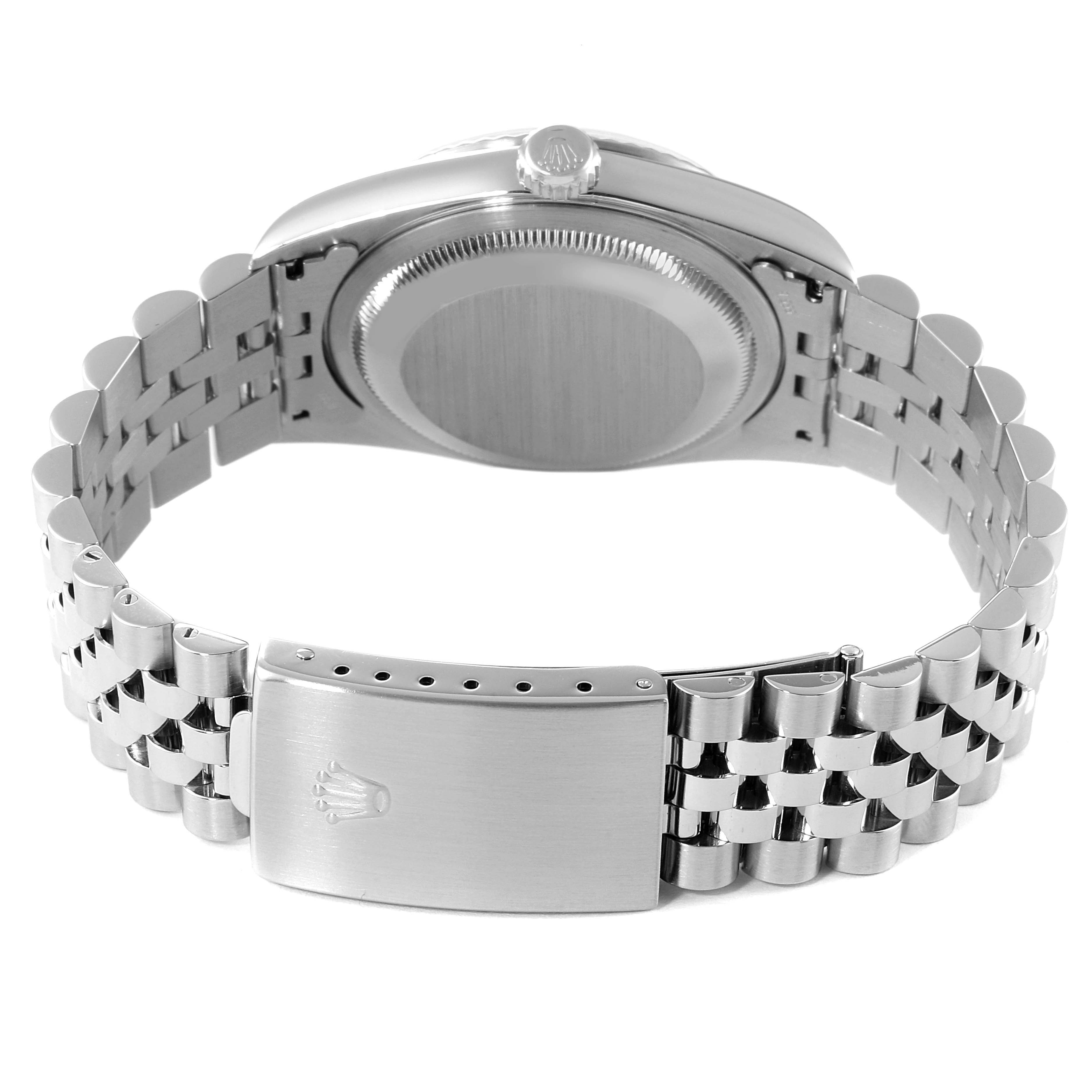 The image shows the back case, crown, and bracelet of a Rolex Datejust 16234 Men's Stainless Steel White Dial 16234 Men's Stainless Steel White Dial watch, focusing on the clasp with the Rolex logo.