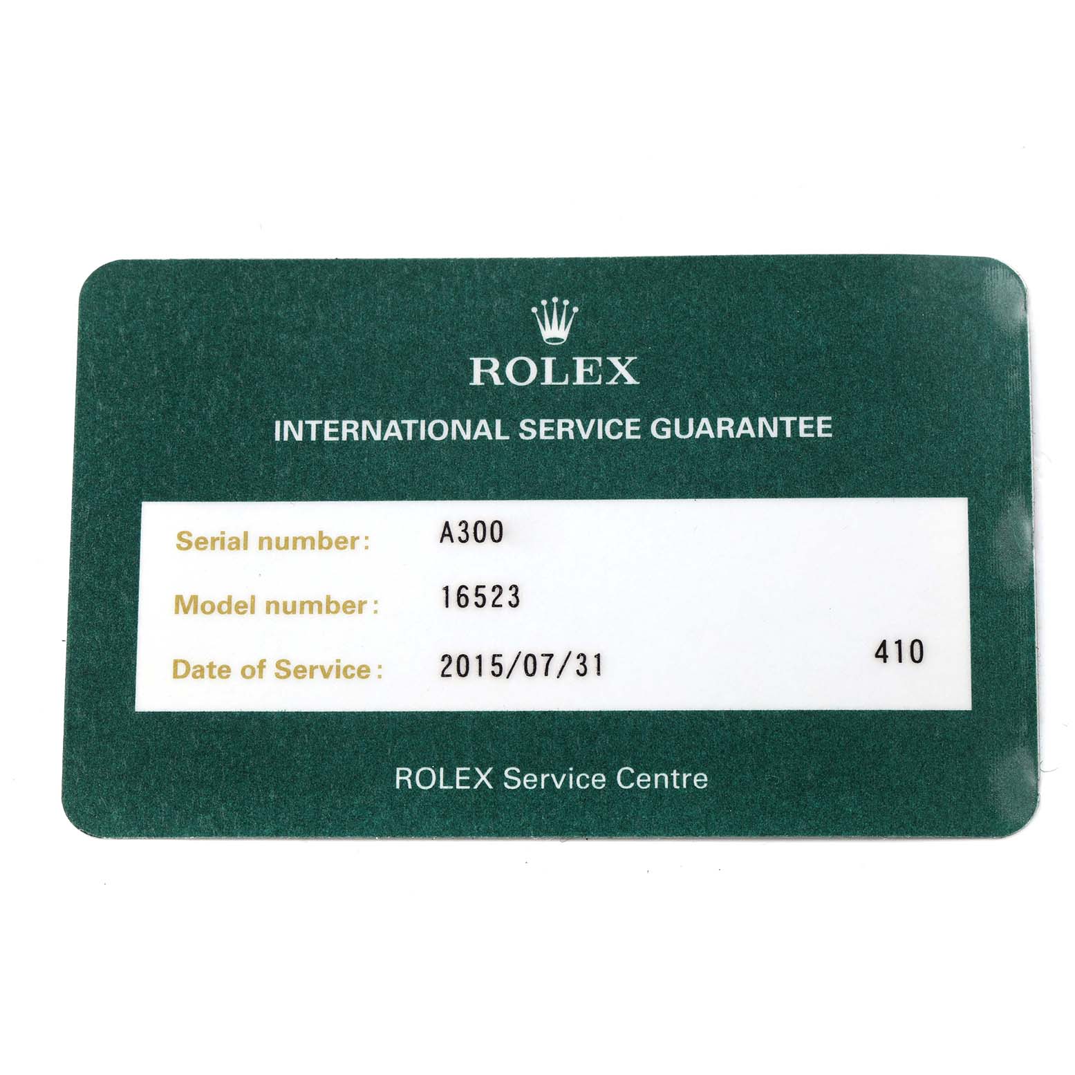 This image shows the International Service Guarantee card for a Rolex Daytona 16523 Men
s Steel and Gold (two tone) White Dial 16523 Men
s Steel and Gold (two tone) White Dial, displaying serial and model numbers.