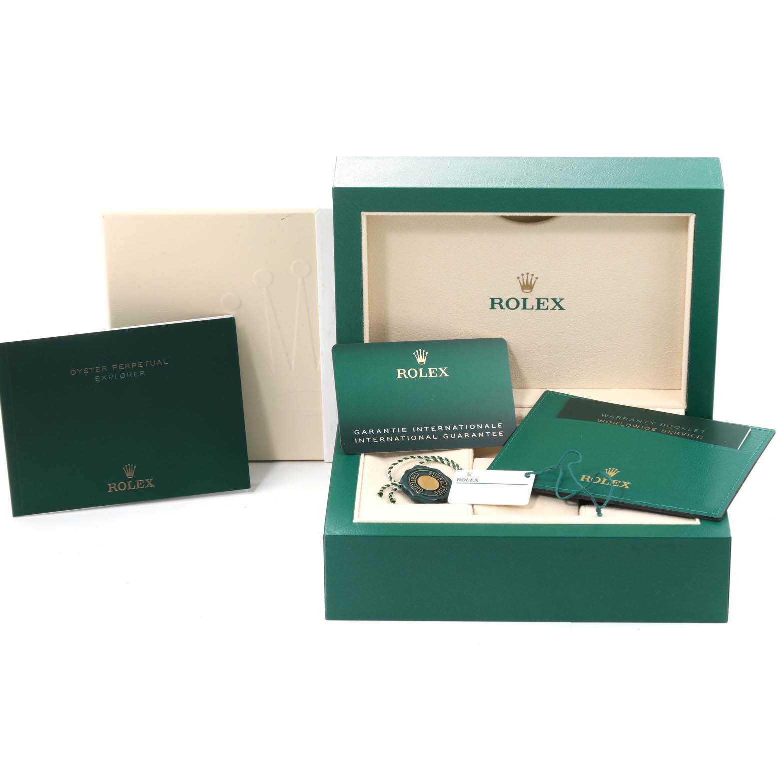 The image shows the packaging and accessories for the Rolex Explorer 124270 Men
s Stainless Steel Black Dial 124270 Men
s Stainless Steel Black Dial model, including the box, warranty card, and booklet.
