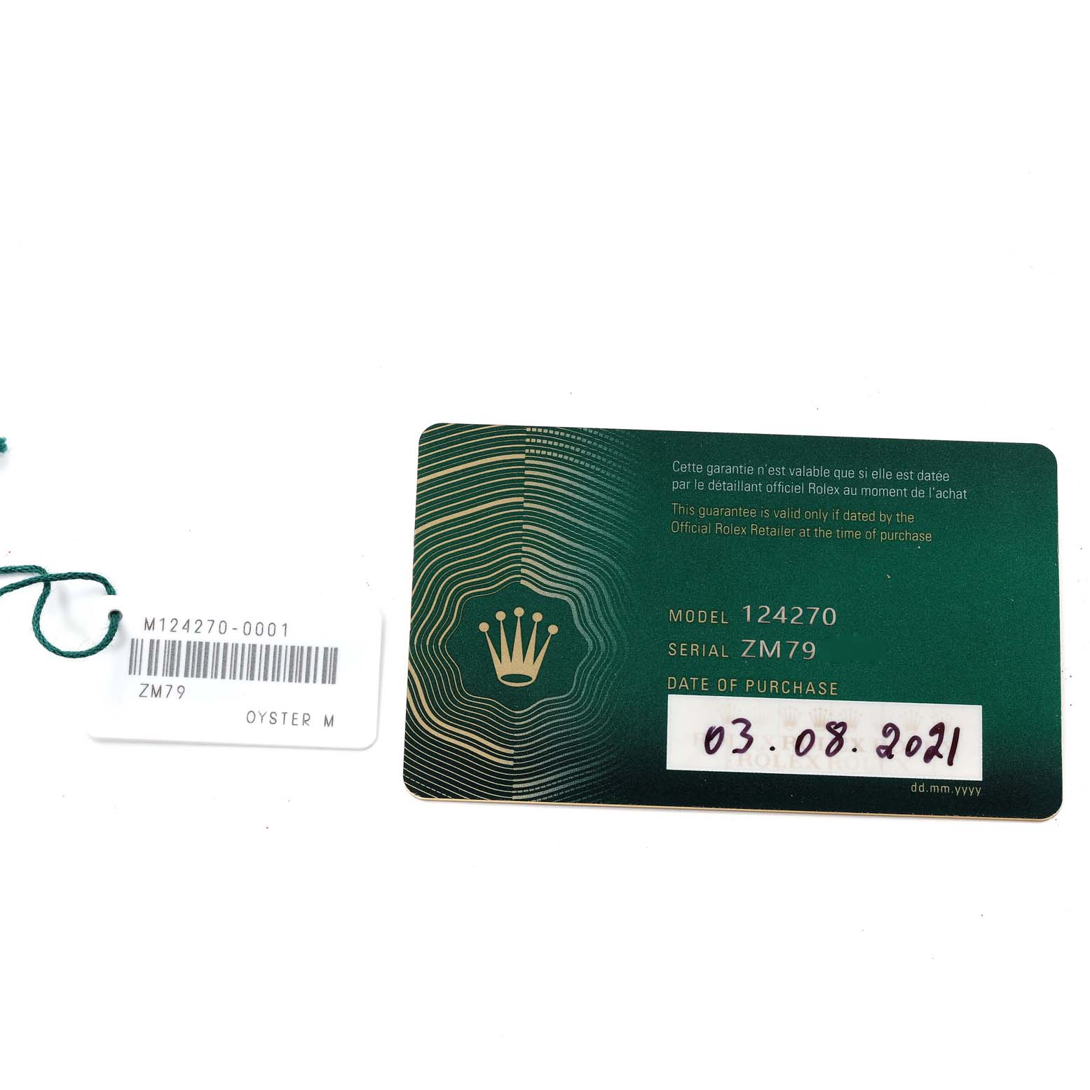 This image shows the warranty card and model tag for the Rolex Explorer 124270 Men
s Stainless Steel Black Dial 124270 Men
s Stainless Steel Black Dial model 124270.