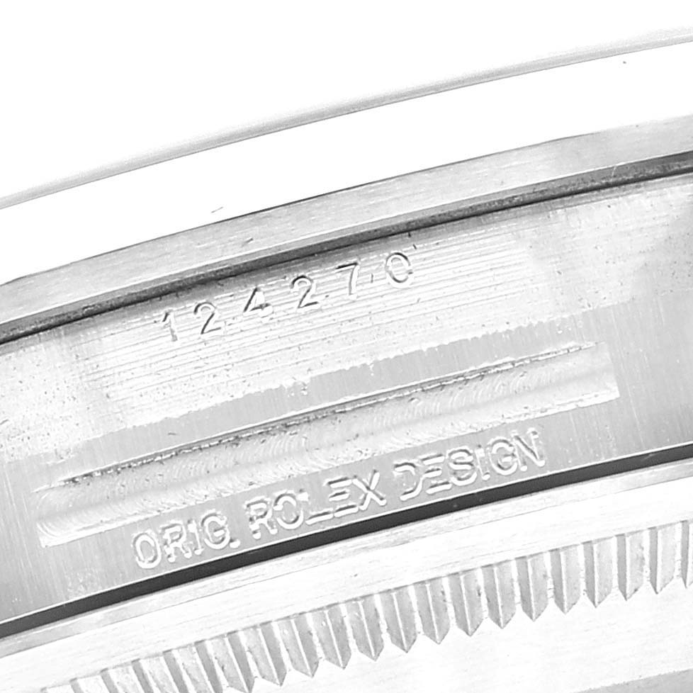This image shows a close-up of the caseback engravings on the Rolex Explorer 124270 Men
s Stainless Steel Black Dial 124270 Men
s Stainless Steel Black Dial model watch, displaying the model number "124270" and "ORIG. ROLEX DESIGN".
