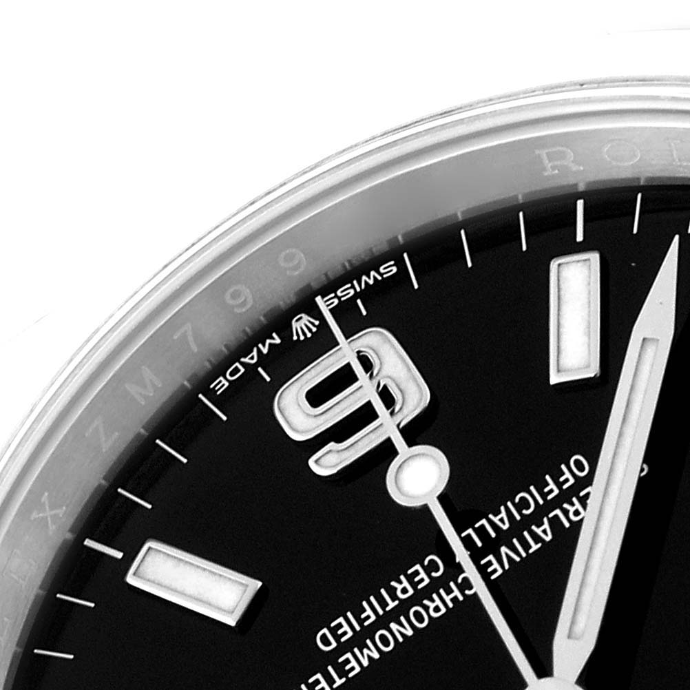 The image shows a close-up of the dial and part of the bezel of a Rolex Explorer 124270 Men
s Stainless Steel Black Dial 124270 Men
s Stainless Steel Black Dial watch.