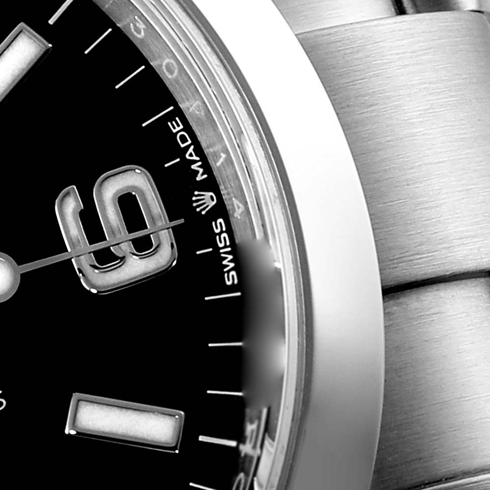 This close-up angle shows the dial, a portion of the bezel, and bracelet of the Rolex Explorer 124270 Men's Stainless Steel Black Dial 124270 Men's Stainless Steel Black Dial model.