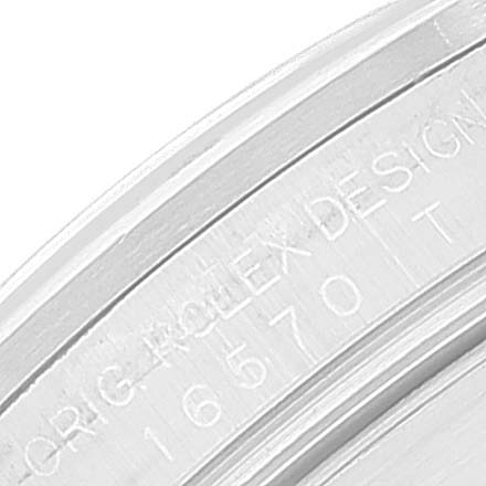 This image shows a close-up of the inner bezel of a Rolex Explorer 16570 Men's Stainless Steel White Dial 16570 Men's Stainless Steel White Dial model, displaying engraved text and the model number 16570.