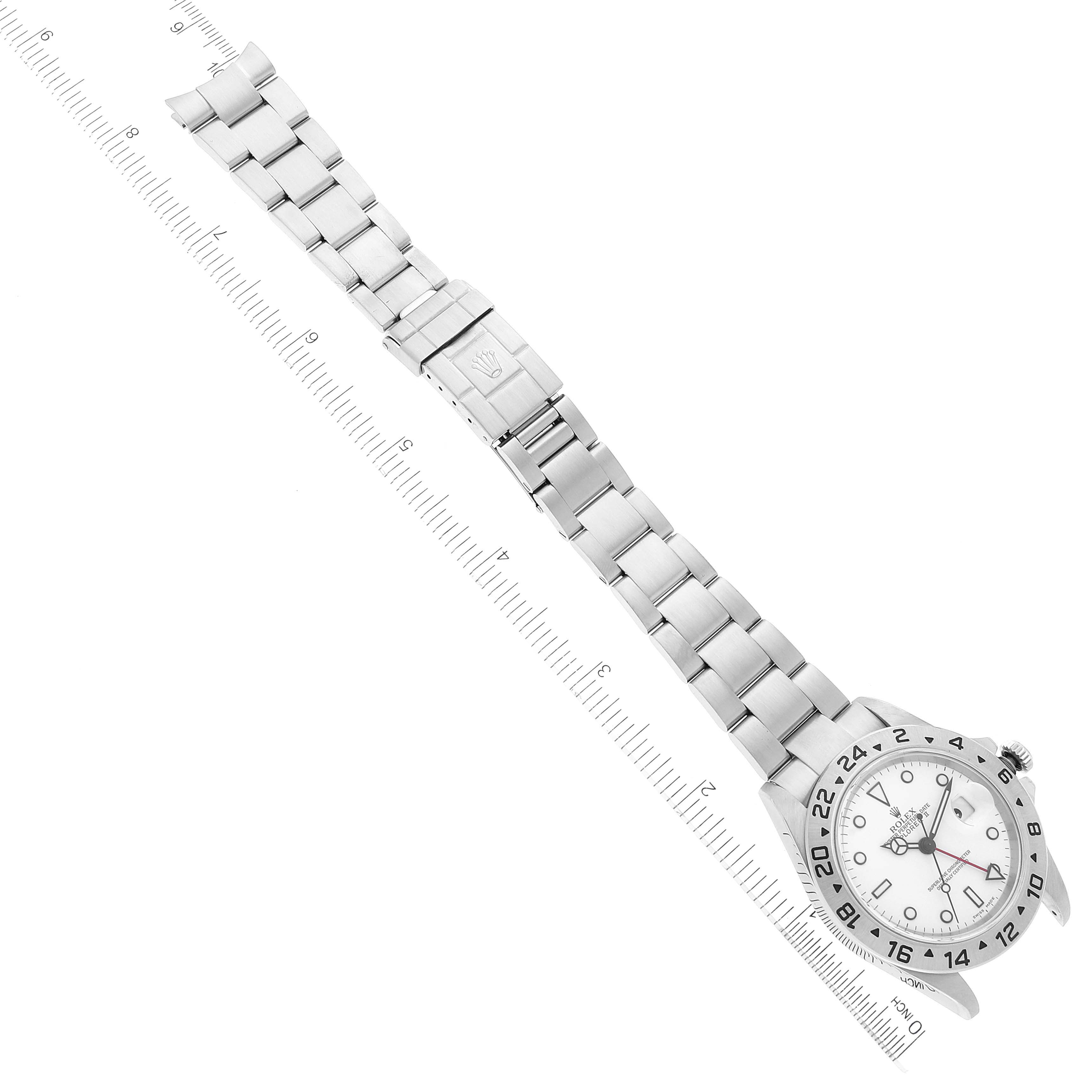 The image shows a Rolex Explorer 16570 Men's Stainless Steel White Dial 16570 Men's Stainless Steel White Dial watch laid out flat with an Oyster bracelet and the face visible, aligned with a ruler.