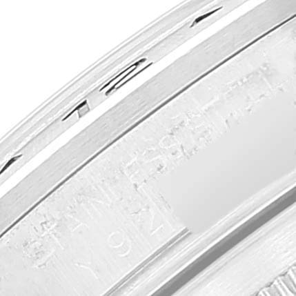 The image shows a close-up of the Rolex Explorer 16570 Men's Stainless Steel White Dial 16570 Men's Stainless Steel White Dial watch's inner bezel with the engraved serial number partially visible.