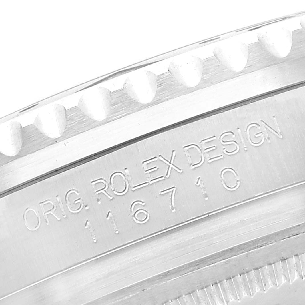 This close-up image shows the engraved serial number and design details on the side of a Rolex GMT-Master 116710 Men
s Stainless Steel Black Dial 116710 Men
s Stainless Steel Black Dial watch case.