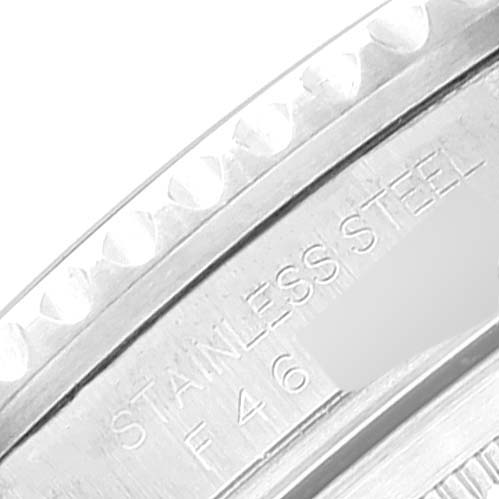 The image shows a close-up of the bezel and case edge engraving reading "STAINLESS STEEL" on the Rolex GMT-Master 16710 Men
s Stainless Steel Black Dial 16710 Men
s Stainless Steel Black Dial.