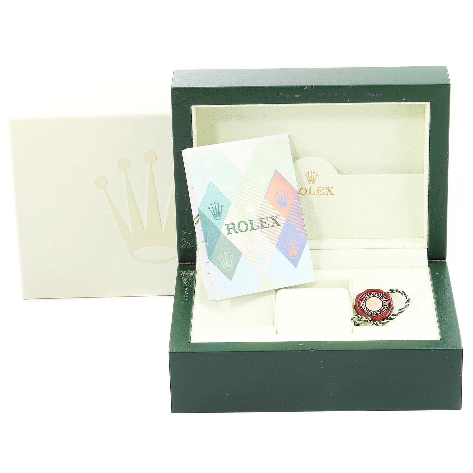 The image shows a Rolex GMT-Master 16710 Men
s Stainless Steel Black Dial 16710 Men
s Stainless Steel Black Dial watch box with a booklet, a tag, and an empty watch cushion inside the open box.