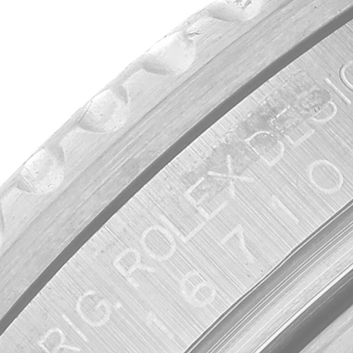 This close-up image of a Rolex GMT-Master 16710 Men
s Stainless Steel Black Dial 16710 Men
s Stainless Steel Black Dial wristwatch shows the engraved details on the case back.