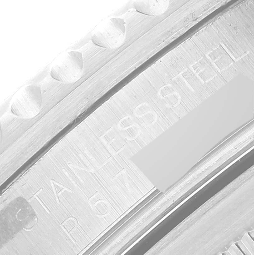 The image shows a close-up of the stainless steel bezel and part of the engraving on a Rolex GMT-Master 16710 Men
s Stainless Steel Black Dial 16710 Men
s Stainless Steel Black Dial watch.