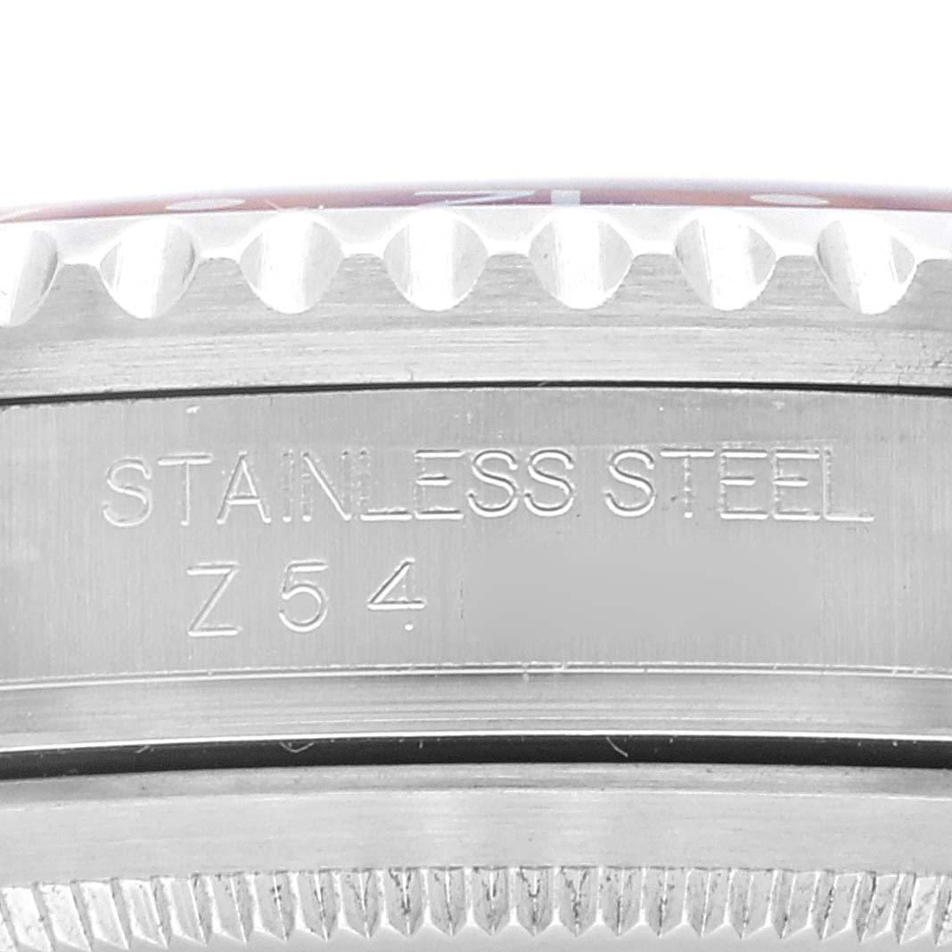 This close-up image shows the stainless steel case side of a Rolex Date 16710 Men's Stainless Steel Black Dial 16710 Men's Stainless Steel Black Dial model watch with engraved details.