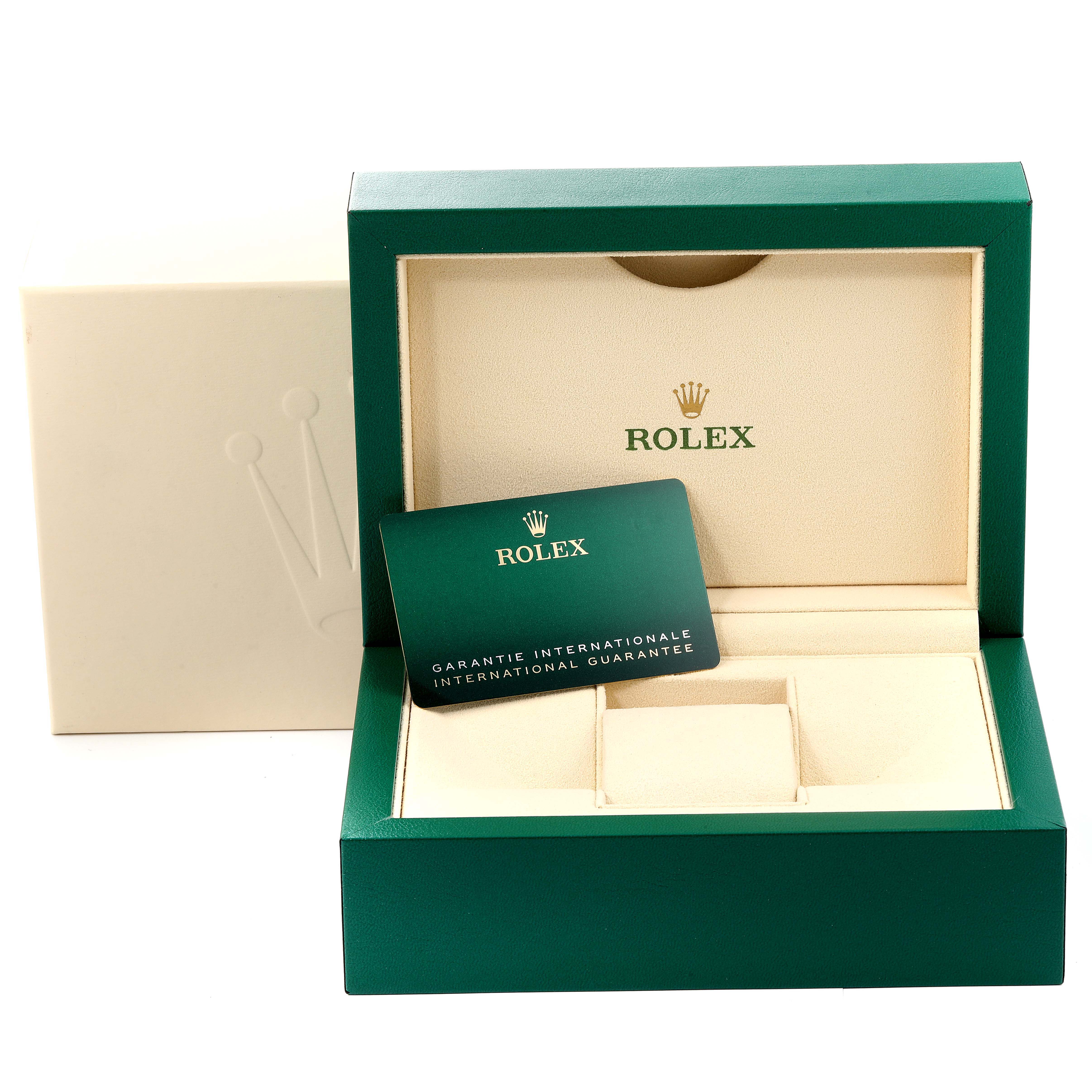 The image shows an open Rolex Oyster Perpetual 124300 Men's Stainless Steel Silver Dial 124300 Men's Stainless Steel Silver Dial watch box with an international guarantee card inside.