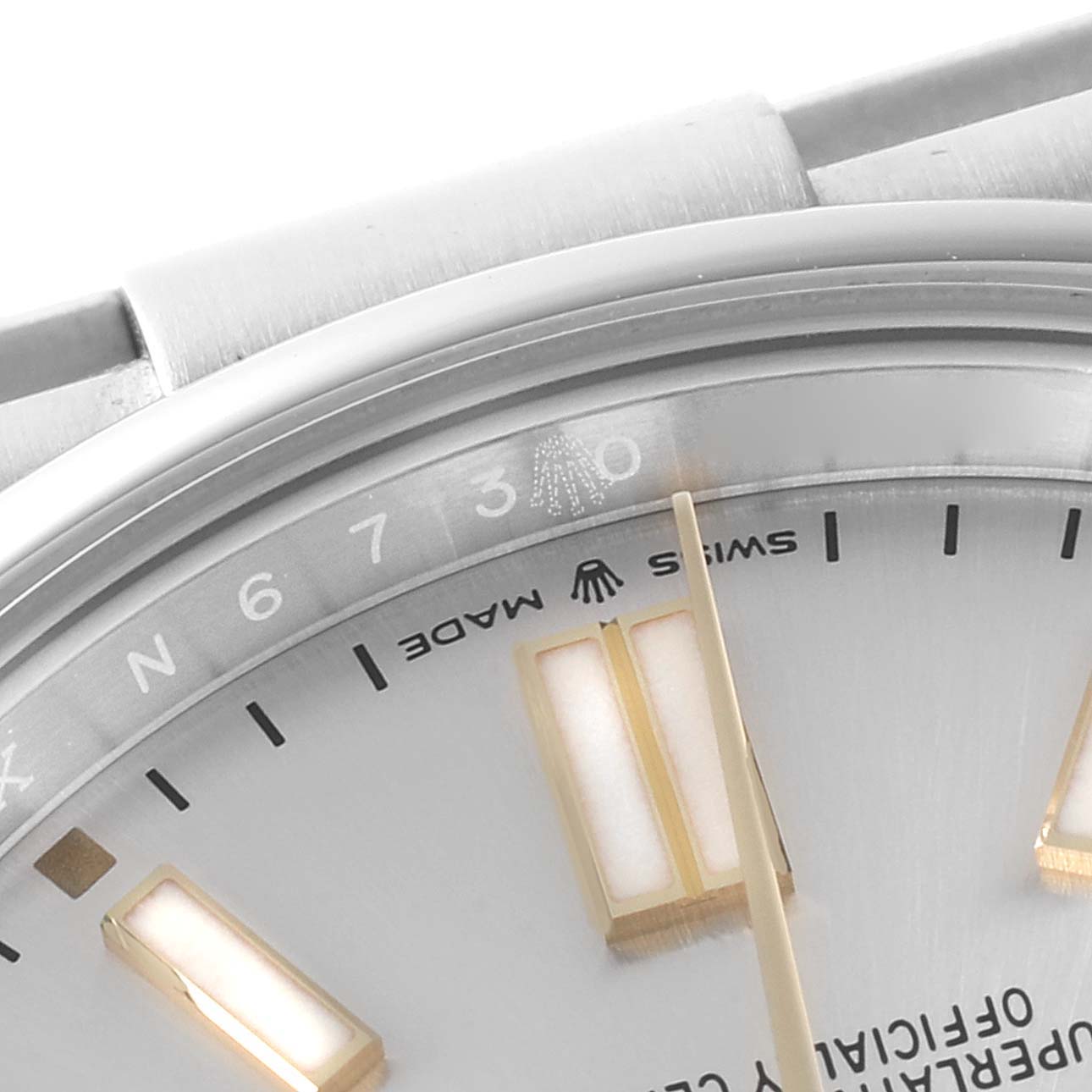 This close-up of the Rolex Oyster Perpetual 124300 Men's Stainless Steel Silver Dial 124300 Men's Stainless Steel Silver Dial watch showcases the dial, hour markers, and partial branding details.