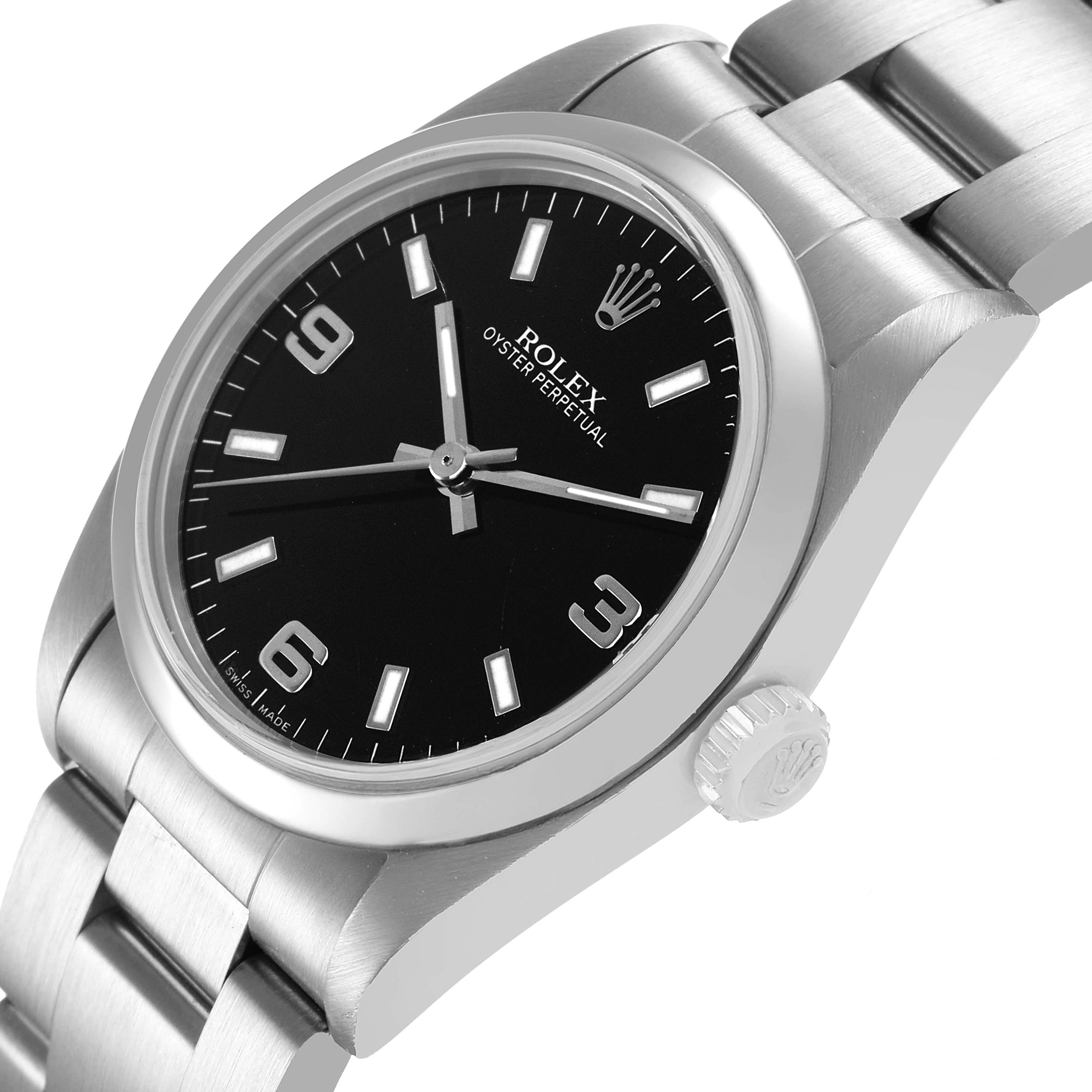 The Rolex Oyster Perpetual 77080 Women's Stainless Steel Black Dial watch is shown at a slight side angle, displaying the dial, bezel, crown, and part of the bracelet.
