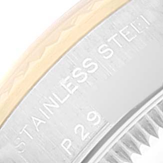 This image shows a close-up of the bezel and part of the case of a Rolex Oyster Perpetual 76193 Women's Steel and Gold (two tone) Silver Dial 76193 Women's Steel and Gold (two tone) Silver Dial watch, highlighting the "STAINLESS STEEL" engraving.