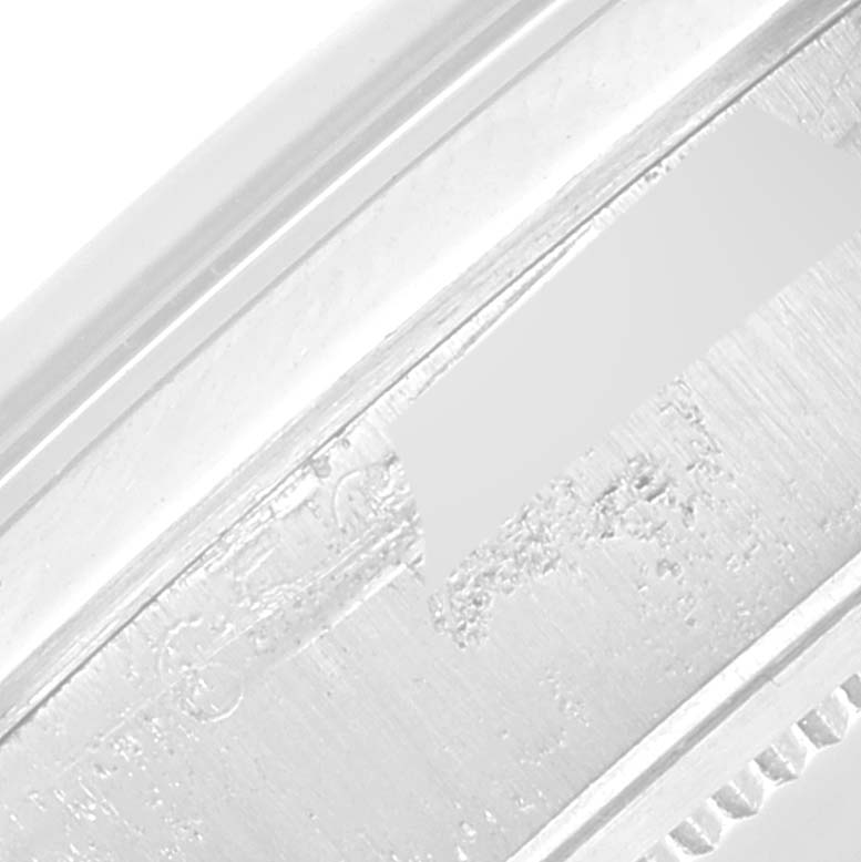 This image shows a close-up view of the side engraving detail on a Rolex Vintage Collection 6694 Men's Stainless Steel Silver Dial 6694 Men's Stainless Steel Silver Dial watch.