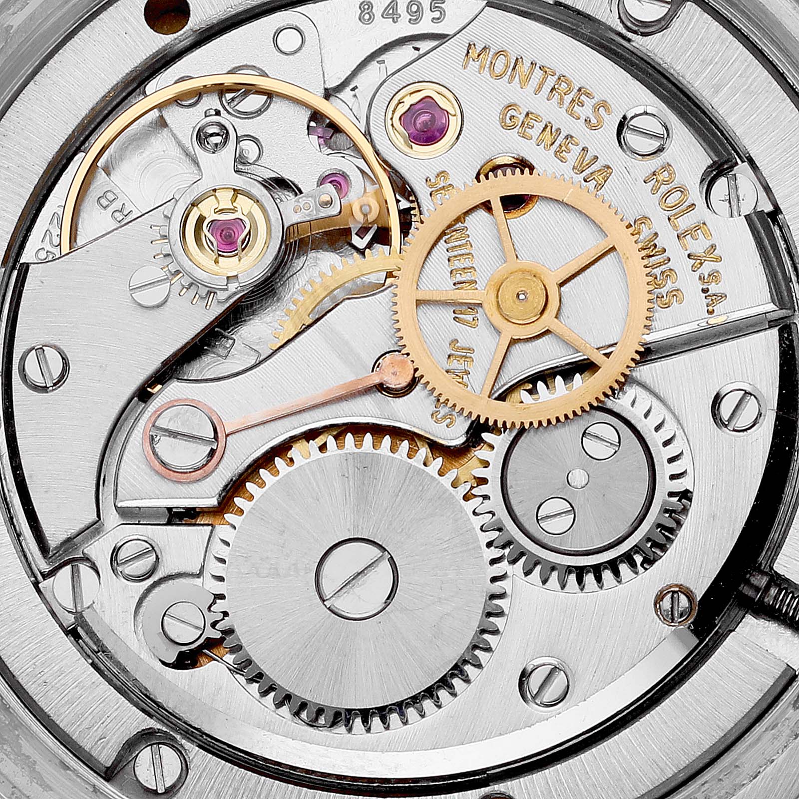 The image shows the internal mechanical movement of a Vintage Collection model by Rolex, highlighting the gears and components.