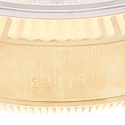 This image shows a close-up of the case edge and bezel of a Rolex President 69178 Women
s Yellow Gold Champagne Dial 69178 Women
s Yellow Gold Champagne Dial model, featuring the model number 69178.