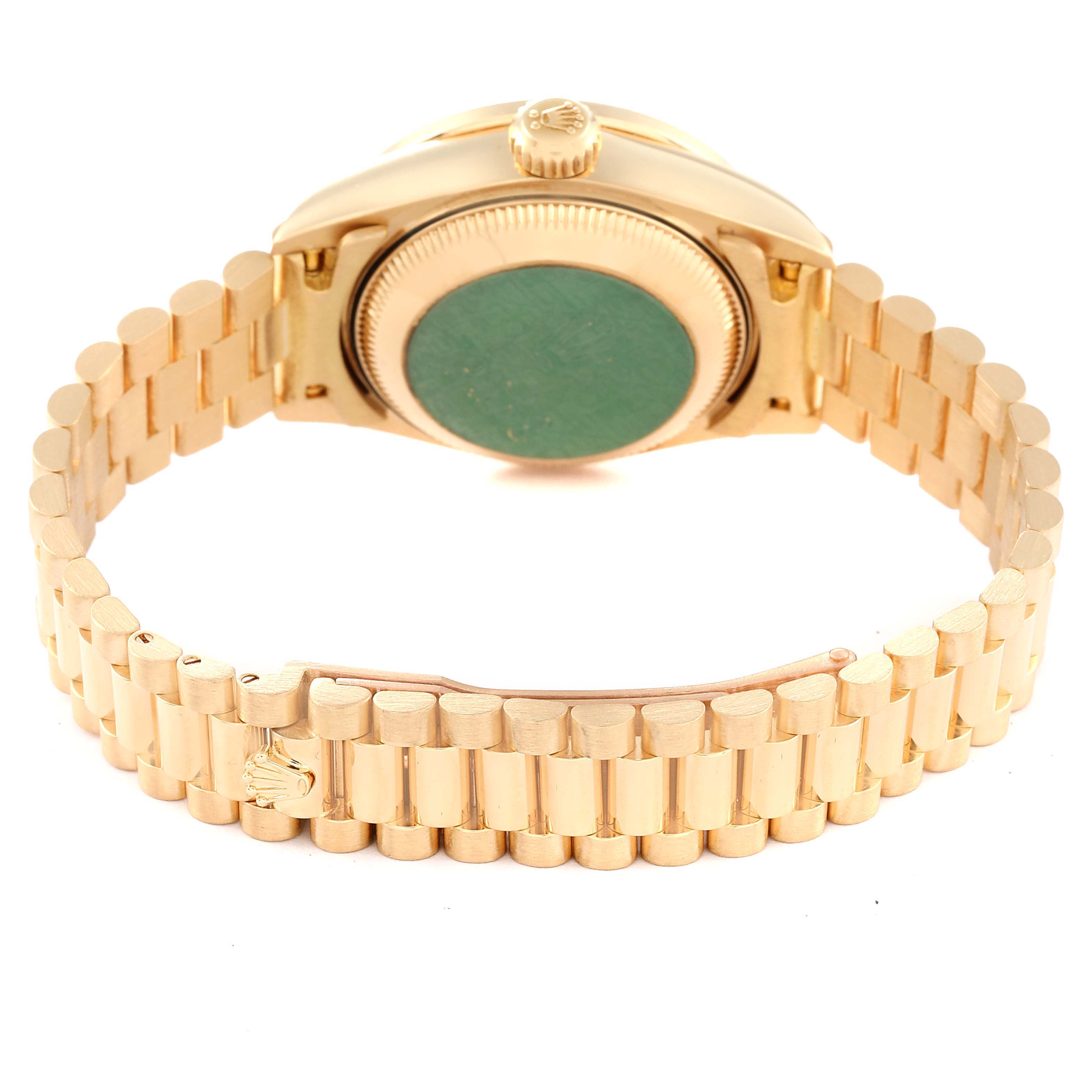 The image shows the back and bracelet of a Rolex President 79068 Women
s Yellow Gold Champagne Dial 79068 Women
s Yellow Gold Champagne Dial model watch, highlighting the gold-toned clasp and case back.