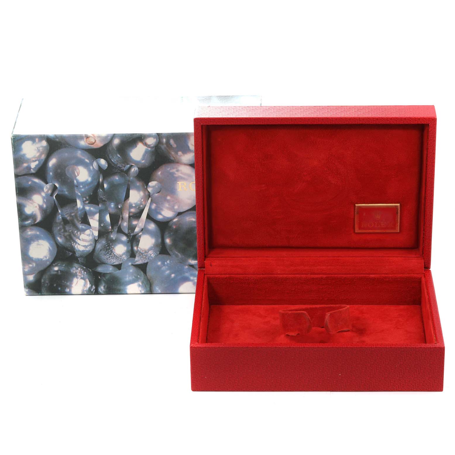 The image shows an open, empty Rolex box for the President model, with its outer decorative case.