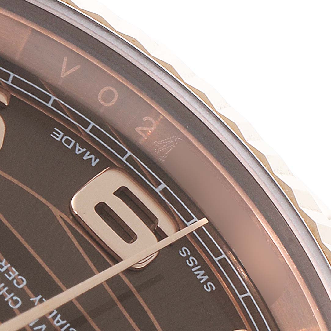 This close-up of the Rolex President 118235 Men's Rose Gold Brown Dial 118235 Men's Rose Gold Brown Dial model watch shows the dial, hour markers, and part of the bezel.