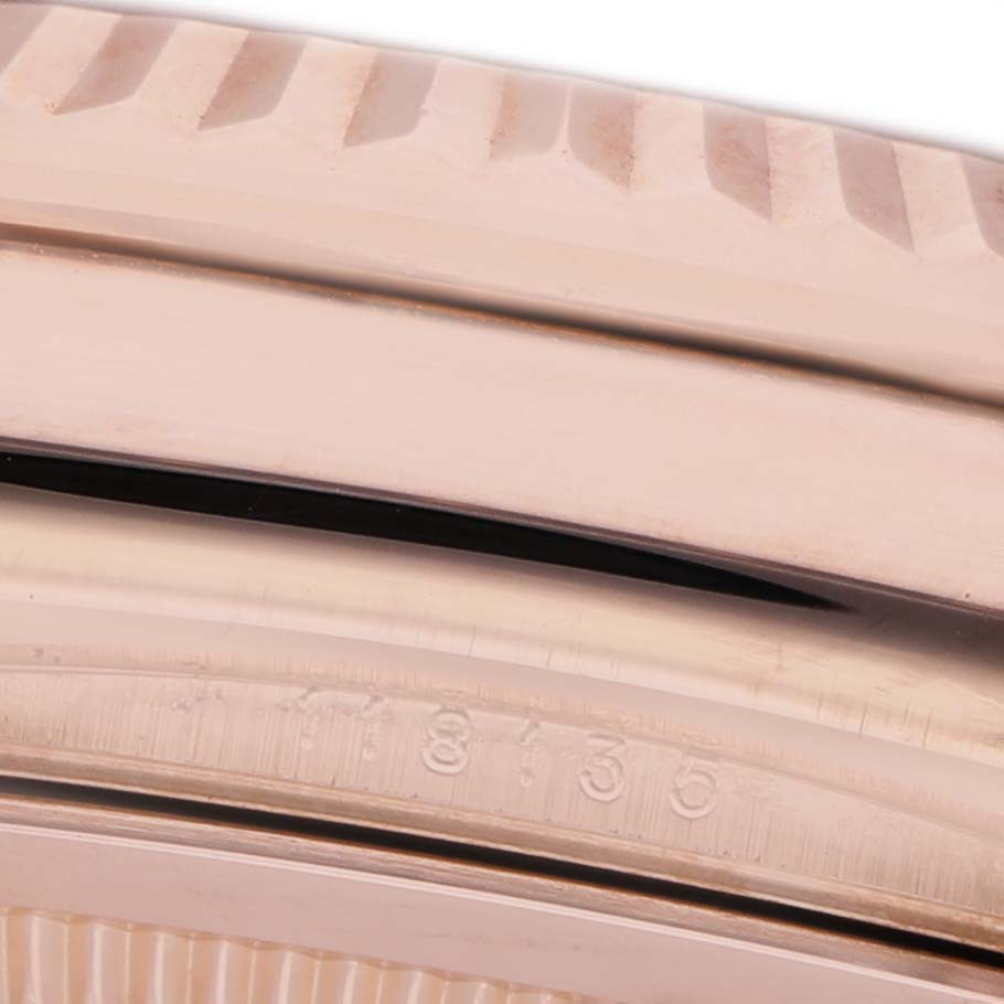 The image shows a close-up of the Rolex President 118135 Men's Rose Gold Silver Dial model's bezel and part of the case edge, with visible model numbers.
