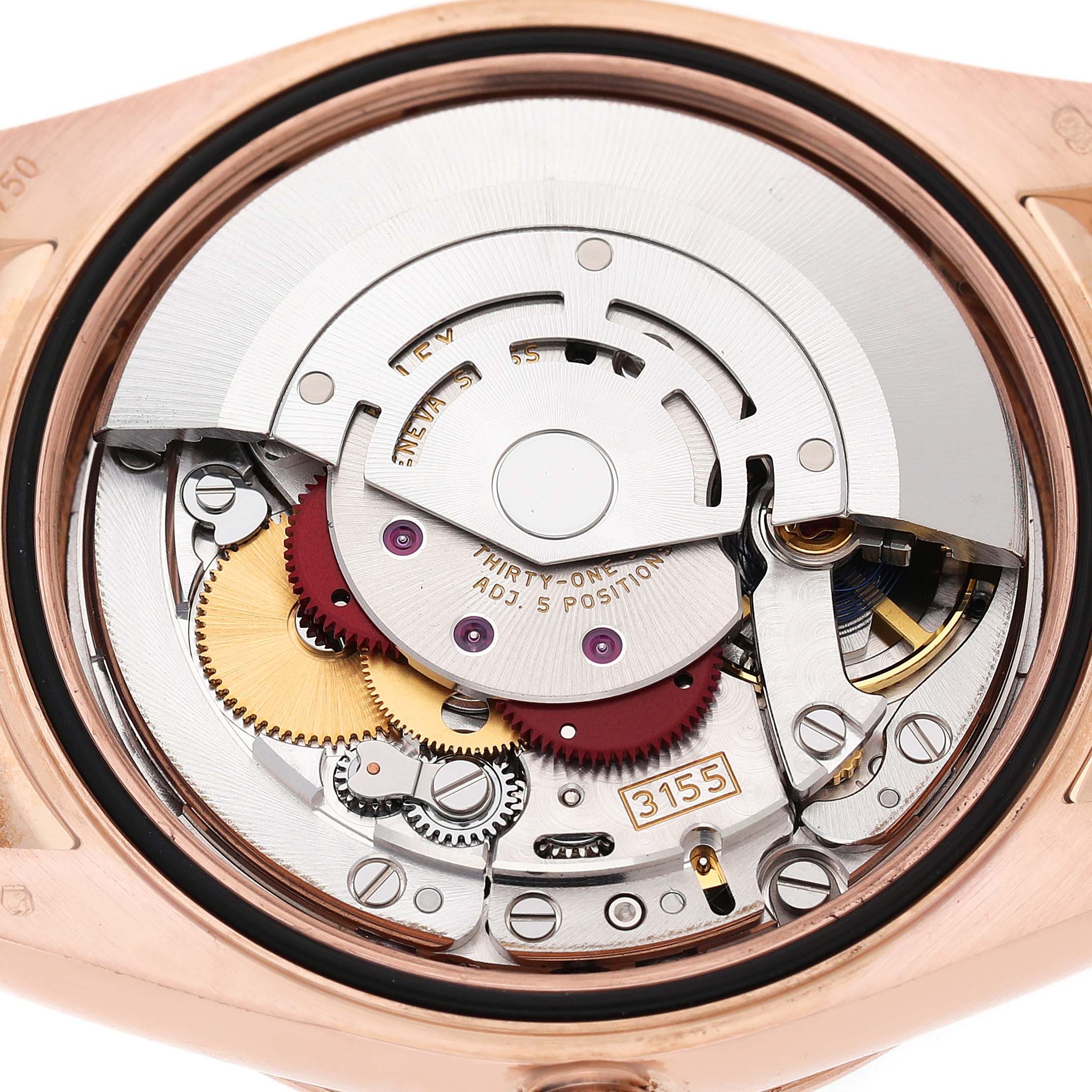 The image shows the inner mechanism of a Rolex President 118135 Men's Rose Gold Silver Dial model, highlighting its gears and movement components from a back angle.