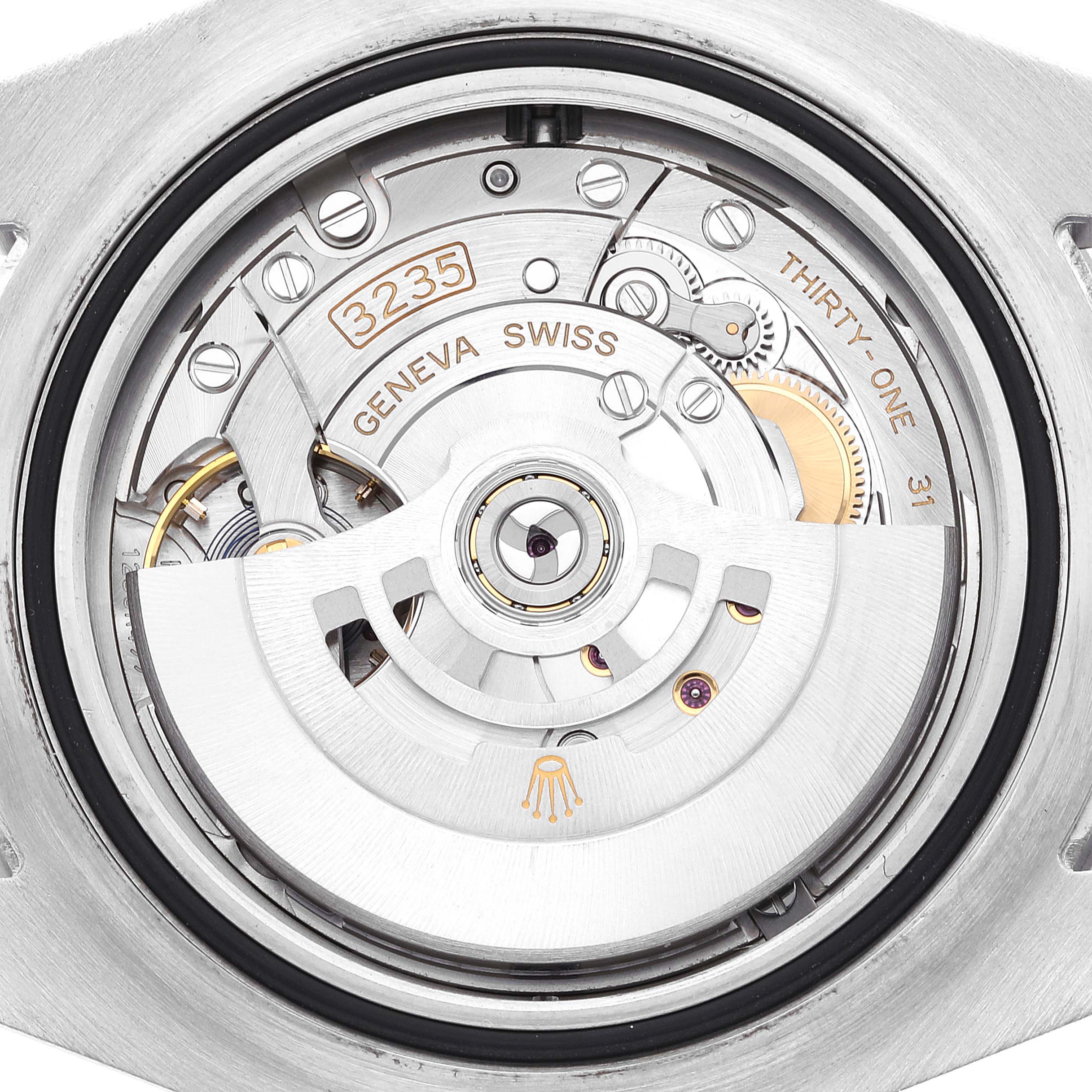 The image shows the movement and internal mechanics of the Rolex Sea-Dweller 126600 Men
s Stainless Steel Black Dial 126600 Men
s Stainless Steel Black Dial watch, including the oscillating weight and gears.