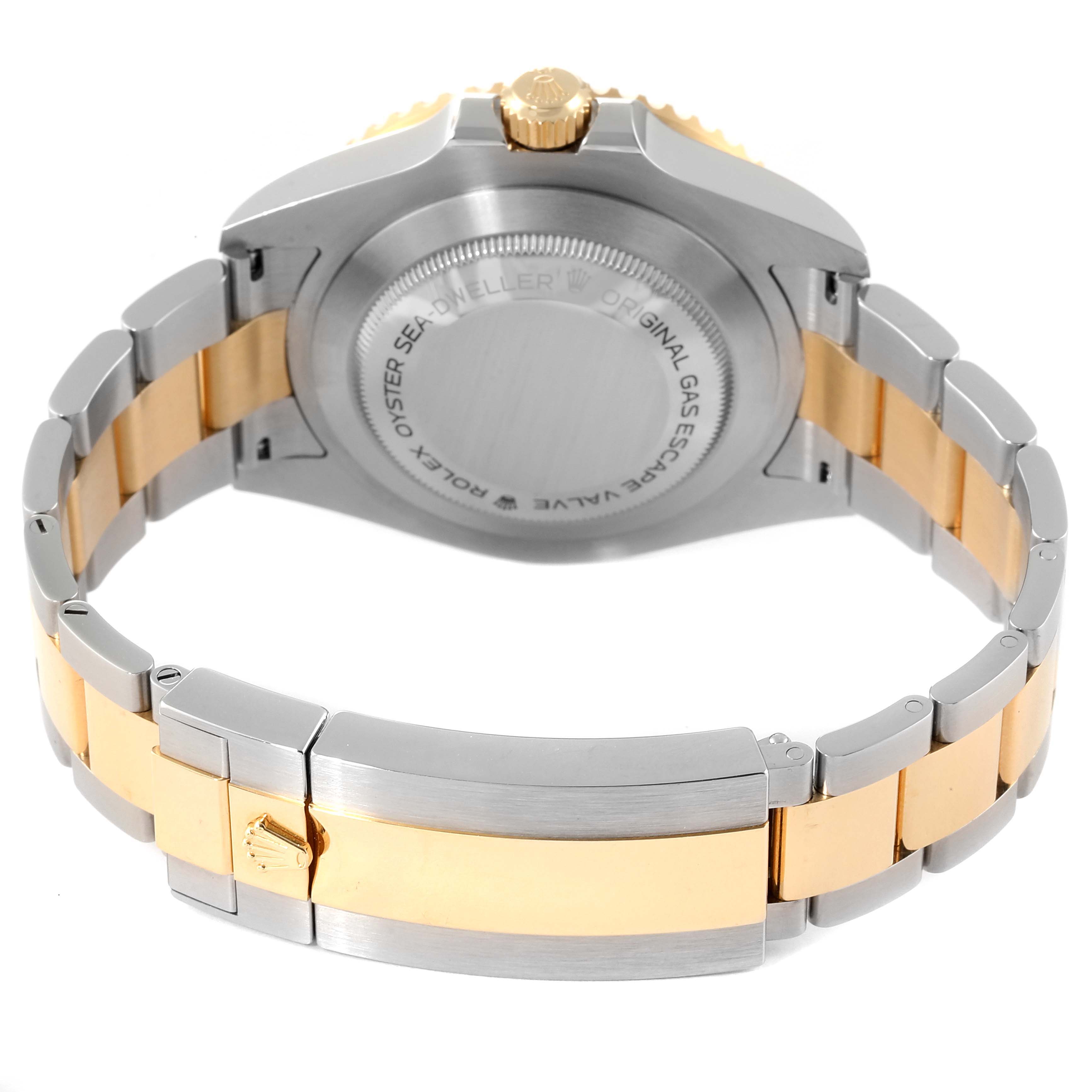The image shows the case back and bracelet of a Rolex Sea-Dweller 126603 Men
s Steel and Gold (two tone) Black Dial 126603 Men
s Steel and Gold (two tone) Black Dial watch, viewed from the back.
