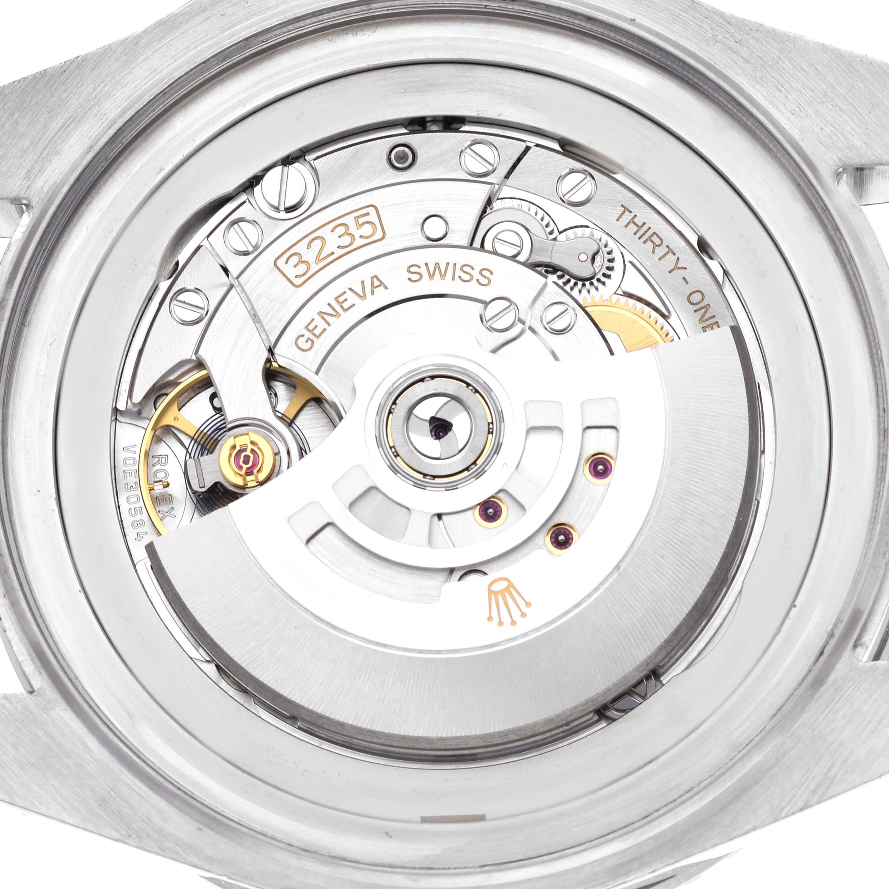 The image shows the movement of a Rolex Sea-Dweller 126660 Men
s Stainless Steel Blue Dial 126660 Men
s Stainless Steel Blue Dial, highlighting the rotor and intricate inner components.