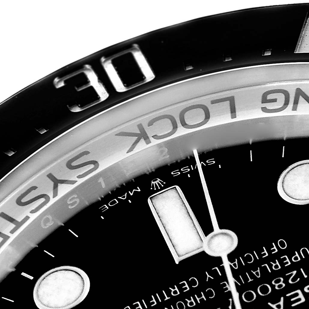 The image shows a close-up of the dial and bezel edge of a Rolex Sea-Dweller 126660 Men
s Stainless Steel Blue Dial 126660 Men
s Stainless Steel Blue Dial, highlighting the numbers and text.