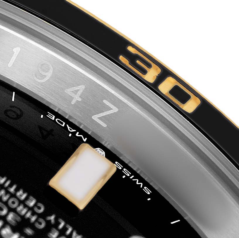 The image shows a close-up of the Rolex Submariner 126613LN Men's Steel and Gold (two tone) Black Dial's bezel and part of the dial, highlighting the minute marker "30."