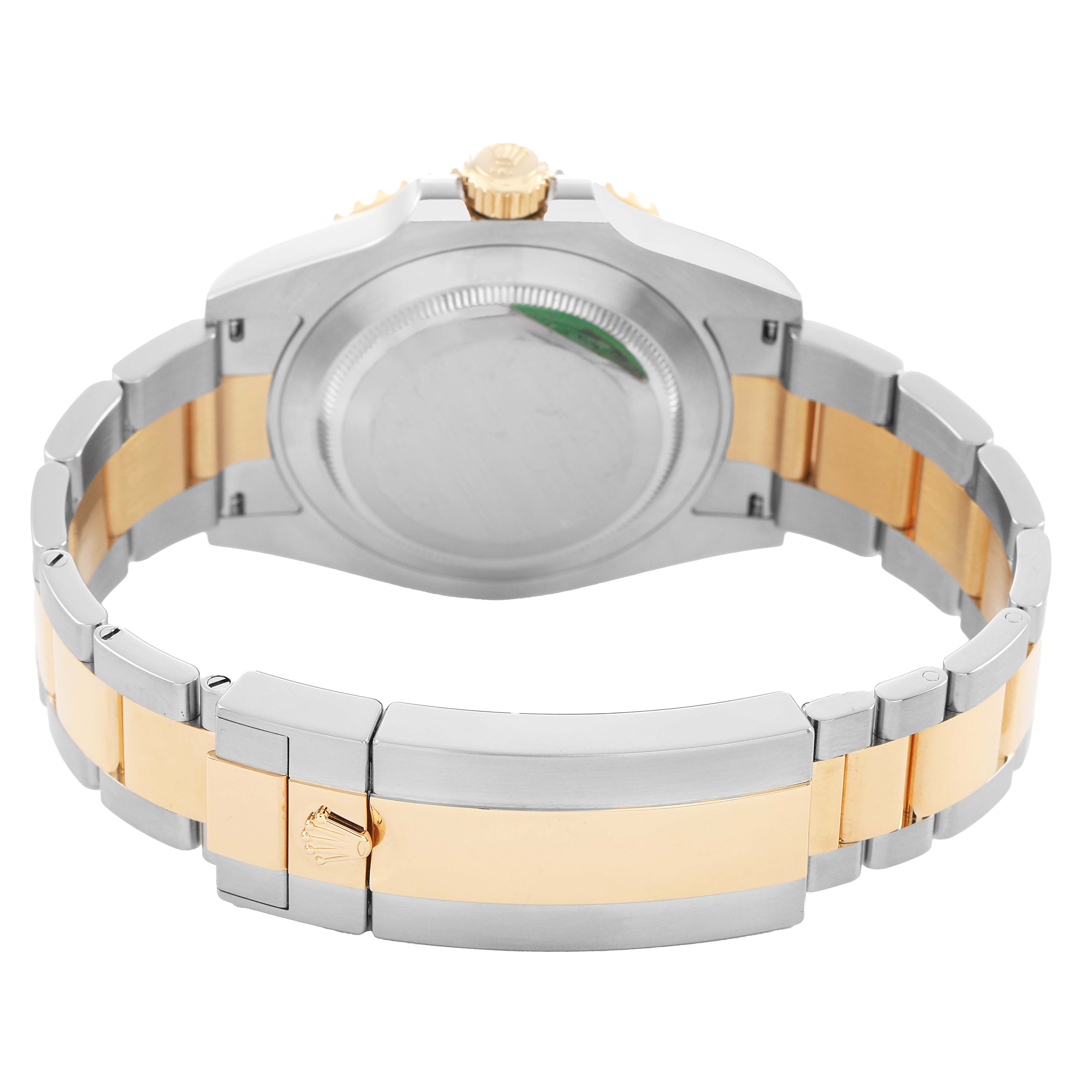 The image shows the back of a Rolex Submariner 126613LN Men's Steel and Gold (two tone) Black Dial, highlighting the gold and silver bracelet and clasp.