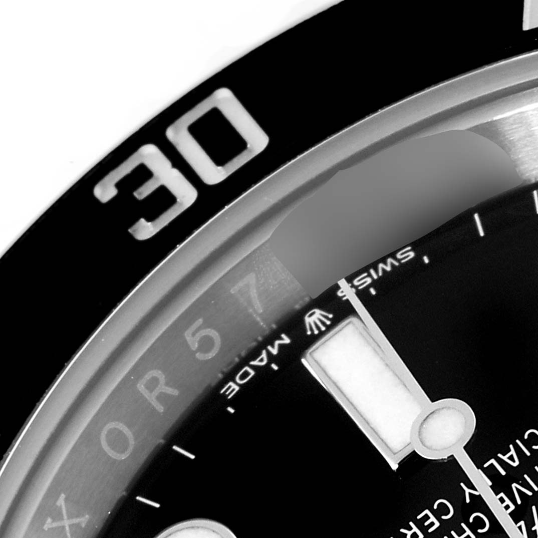The image shows a close-up of the bezel and dial of a Rolex Submariner 126610 Men
s Stainless Steel Black Dial 126610 Men
s Stainless Steel Black Dial, highlighting the 30-minute marker and portions of the hour hand and text on the dial.