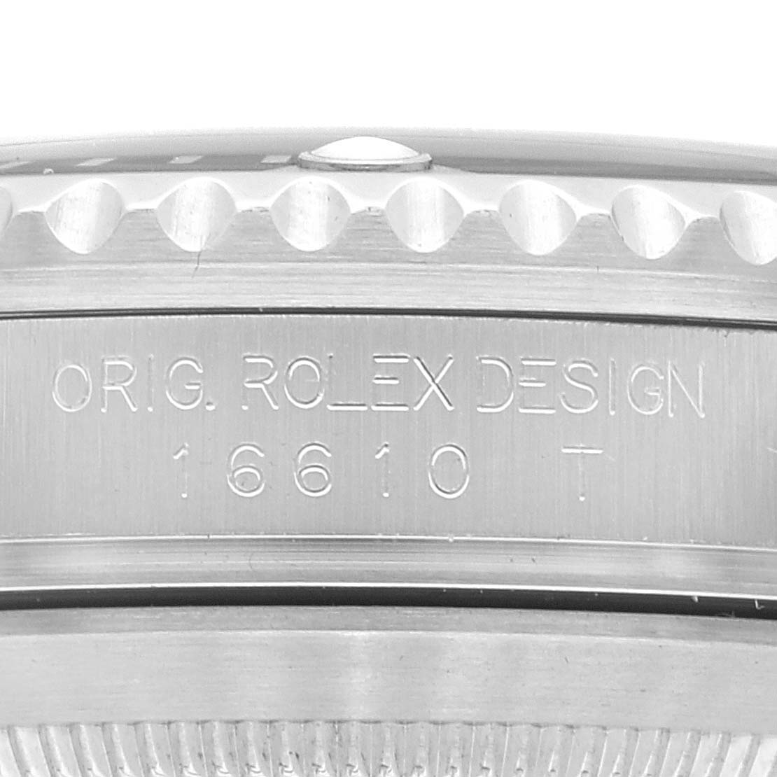 The image shows a close-up of the side engraving on a Rolex Submariner 16610 Men's Stainless Steel Black Dial 16610 Men's Stainless Steel Black Dial watch, model number 16610T.