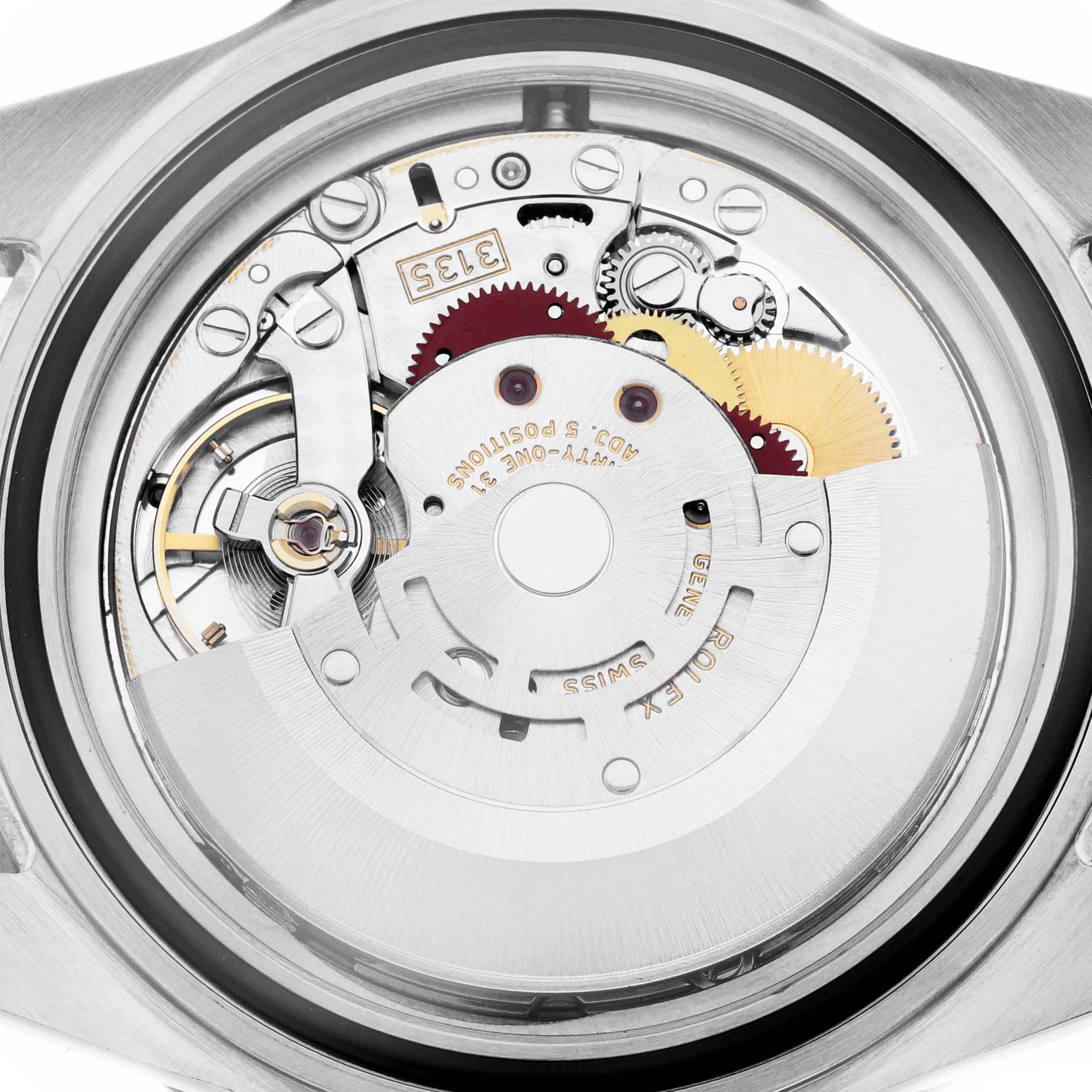 The image shows the movement of a Rolex Submariner 16610 Men
s Stainless Steel Black Dial 16610 Men
s Stainless Steel Black Dial watch from a rear angle, highlighting its intricate gears and mechanisms.