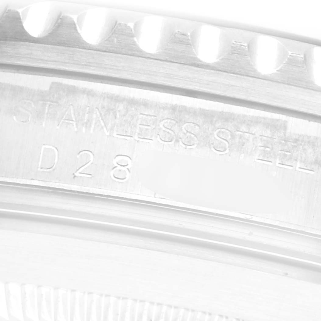 The image shows a close-up of the bezel and case side of the Rolex Submariner 16610 Men
s Stainless Steel Black Dial 16610 Men
s Stainless Steel Black Dial, highlighting the stainless steel engraving.