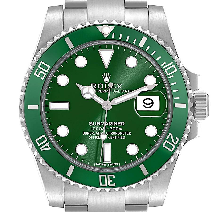 The Rolex Submariner watch is shown from a front angle, highlighting its green dial, bezel, and bracelet.