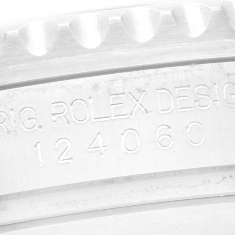The image shows a close-up of the side engraving on a Rolex Submariner 124060 Men
s Stainless Steel Black Dial 124060 Men
s Stainless Steel Black Dial, revealing the model number "124060."