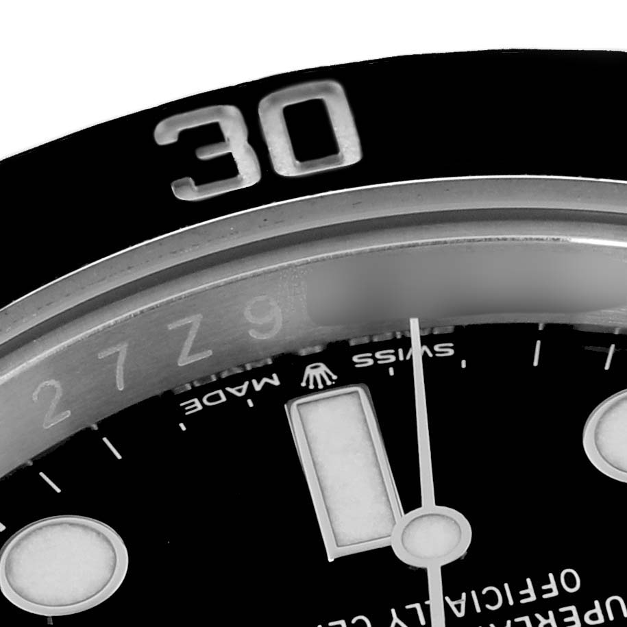 The image shows a close-up of the bezel and dial of a Rolex Submariner 124060 Men
s Stainless Steel Black Dial 124060 Men
s Stainless Steel Black Dial watch, highlighting the "30" on the bezel and part of the dial.