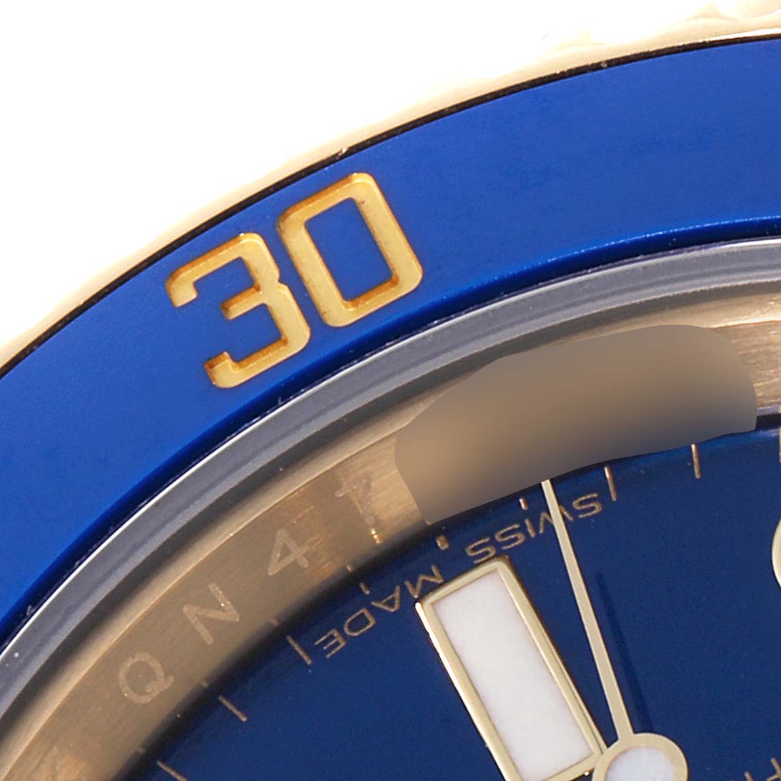 The image shows a close-up of the bezel and dial with hour markers of a Rolex Submariner 116618 Men's Yellow Gold Blue Dial 116618 Men's Yellow Gold Blue Dial watch angled at about 12:05.
