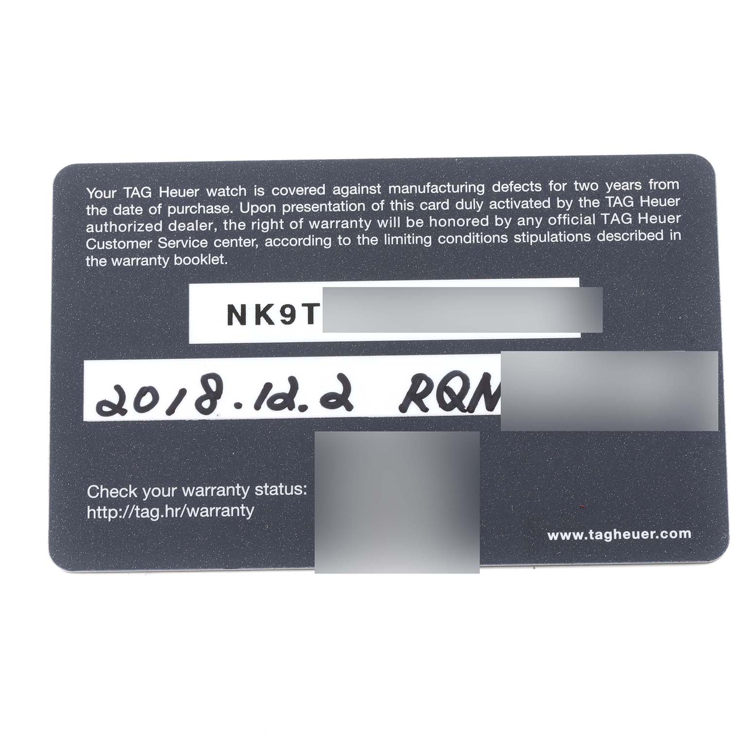 This is a WARRANTY card for the limited edition TAG Heuer model watch, shown from the top angle.